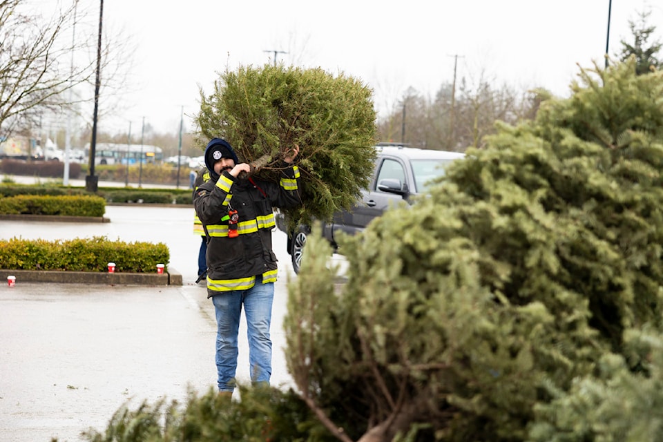 Surrey Fire Charitable Society hosted its annual tree chip at a parking lot in Guildford Town Centre in Surrey on Saturday, Jan. 4, 2025. 