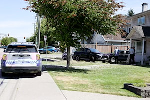 Surrey Police execute search warrant at home in Newton