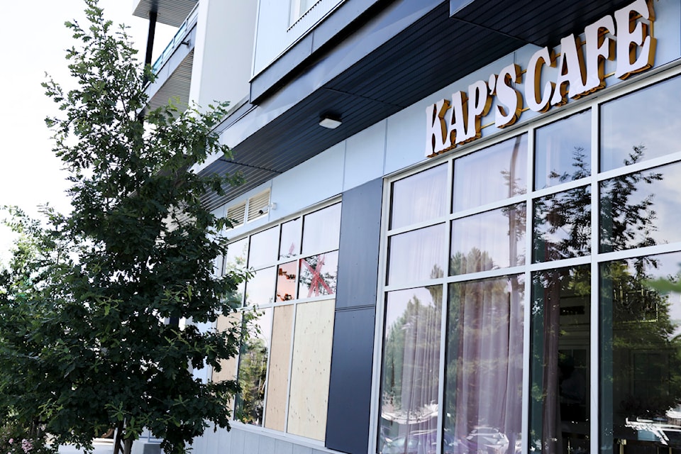 Several windows were boarded up at Kap’s Café in Newton Friday, July 11, after Thursday’s shooting. 