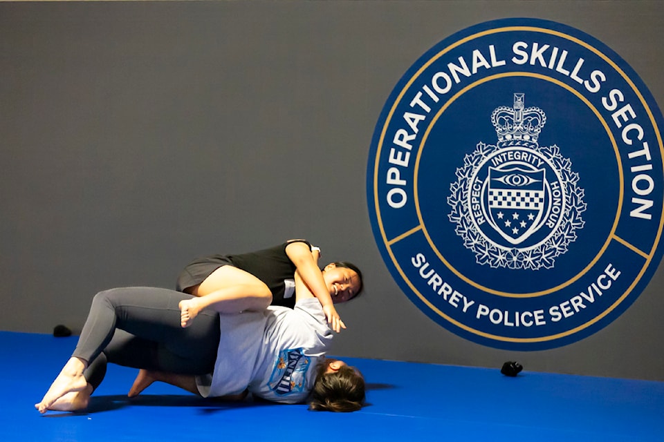 Two participants are trying out some of the Gracie Survival Tactics they just learned at the Surrey Police Service women’s workshop for females interested in becoming police officers. 