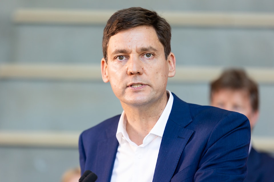 B.C. Premier David Eby, seen here at a press conference in Surrey earlier in July, wants information from a bail hearing for Adam Mann to be made public. Mann is charged with second-degree murder in the death of Surrey's Tori Dunn.