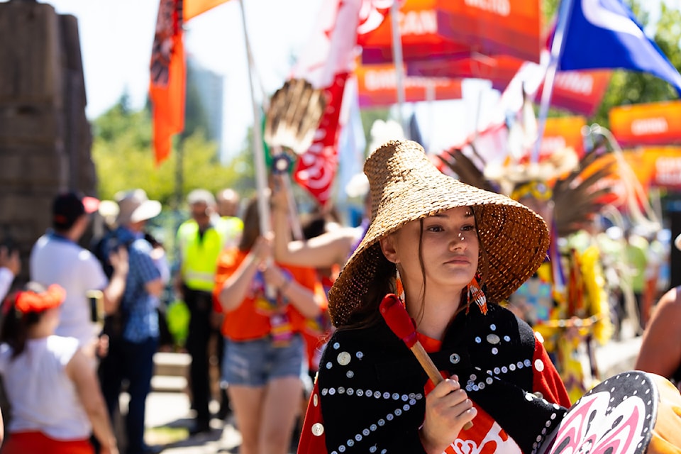 Cultural pavilion organizers walking in the Parade of Culture at the Surrey Fusion Festival in Holland Park in Surrey on Saturday, July 20, 2024.  