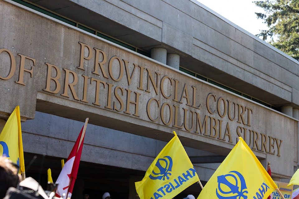 Demonstrators gathered outside Surrey provincial court on Wednesday, Aug. 7, 2024.  