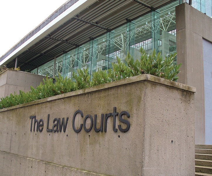 Signs and exterior of the Vancouver Law Courts. - stock photos