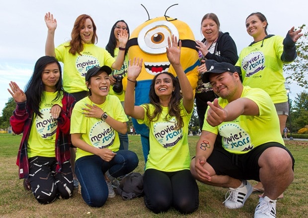 Downtown Surrey BIA student interns pose with a minion and Bonnie Brnside.