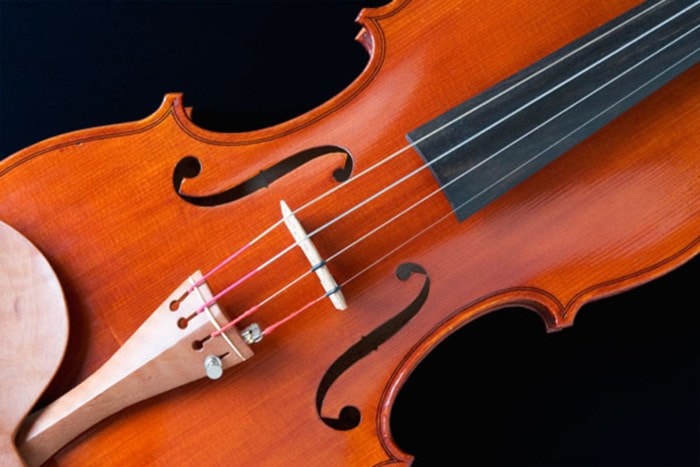 A violin on a black background.