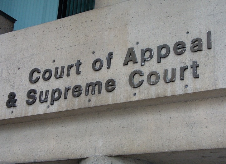 Signs and exterior of the Vancouver Law Courts. - stock photos