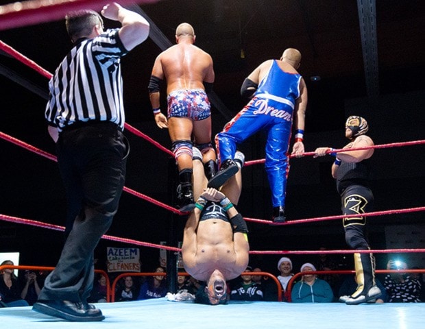 Six-man tag team action.