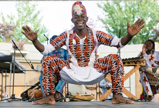 Kesse Ke of the band "Kunda Africa" in mid-dance