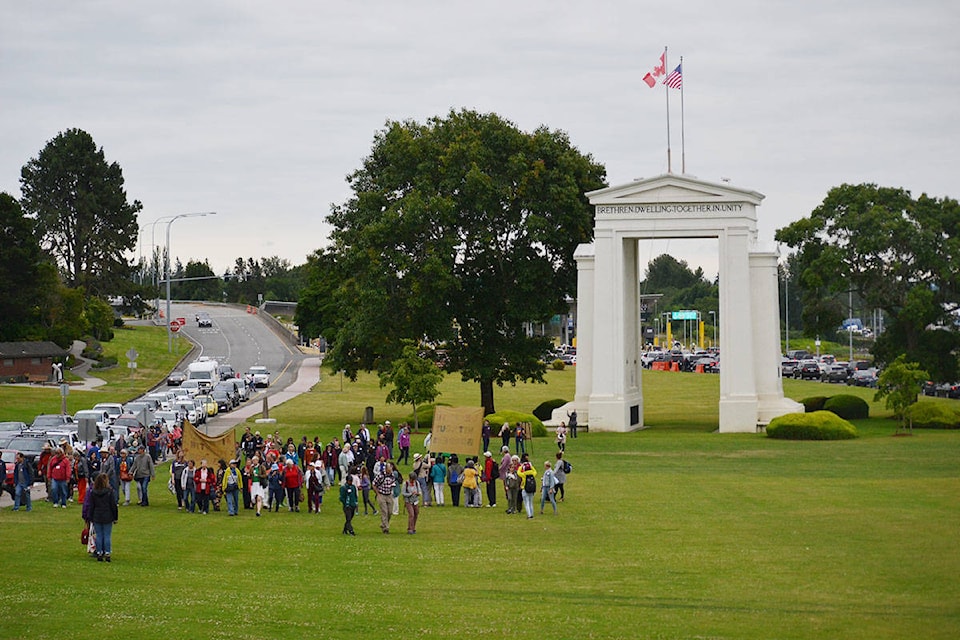 Canadians with dementia, their caregivers, and their U.S. counterparts met at the Peace Arch Park Wednesday to exchange pleasantries and gifts. (Aaron Hinks photo)