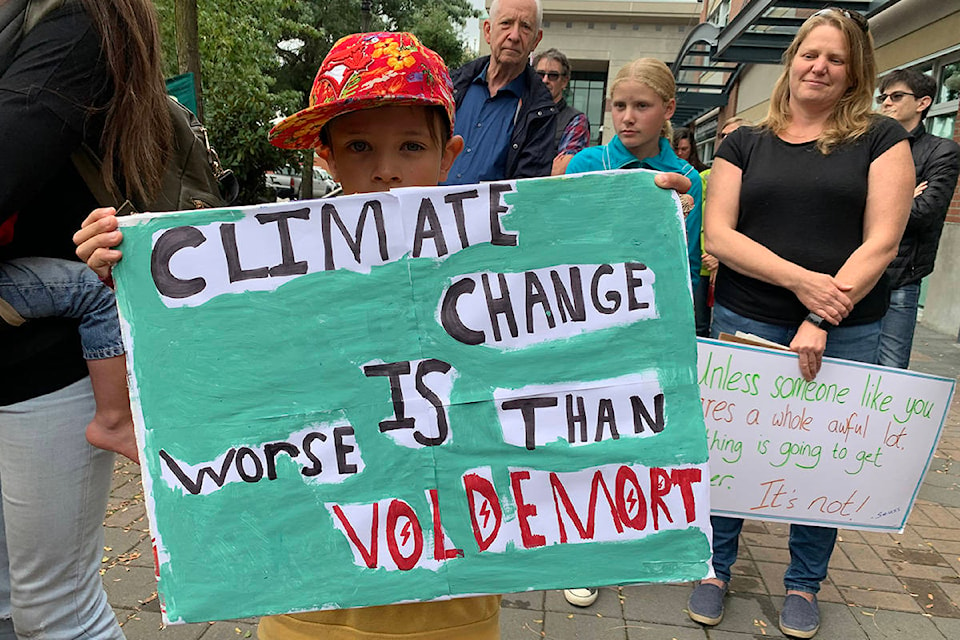 Young boy holds sign in Chilliwack, B.C. for Sept. 20, 2019 demonstration, demanding more action on climate change. (Paul Henderson/Chilliwack Progress)