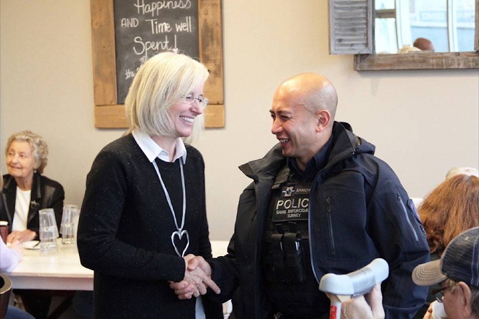 Tamara Jansen chats with a police officer at the RCMP’s informal “Coffee with Cops” chat session in Cloverdale Oct. 16. (Photo: Malin Jordan)