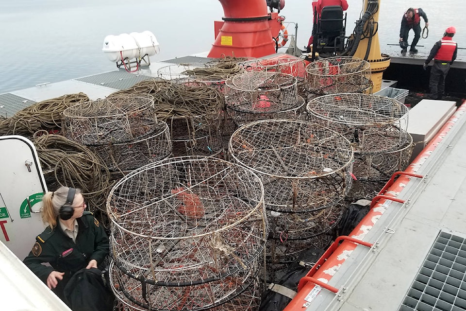 A joint effort between local fishery officers, the Canadian Coast Guard and others resulted in the seizure of more than 300 illegal crab traps in Boundary Bay near White Rock this month. (Fisheries and Oceans Canada photo)