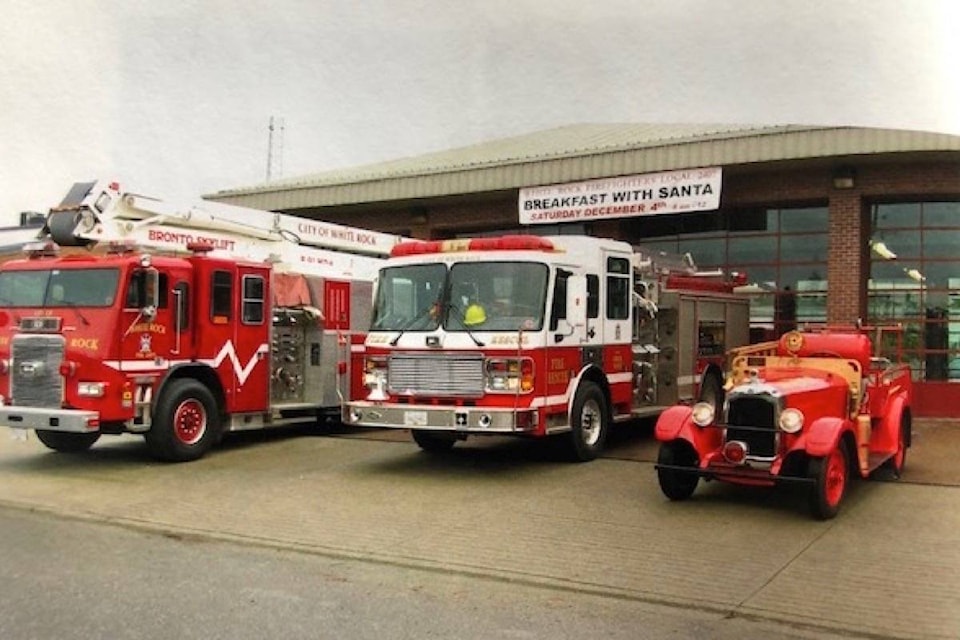 White Rock’s original fire truck is tiny alongside newer vehicles, as seen when it was previously displayed at the city’s fire hall in 2011. Contributed photo