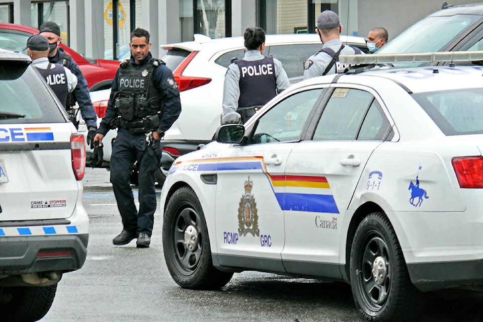 Heavily armed police officers responded to a call on 203rd Street near Fraser Highway. (Dan Ferguson/Langley Advance Times)