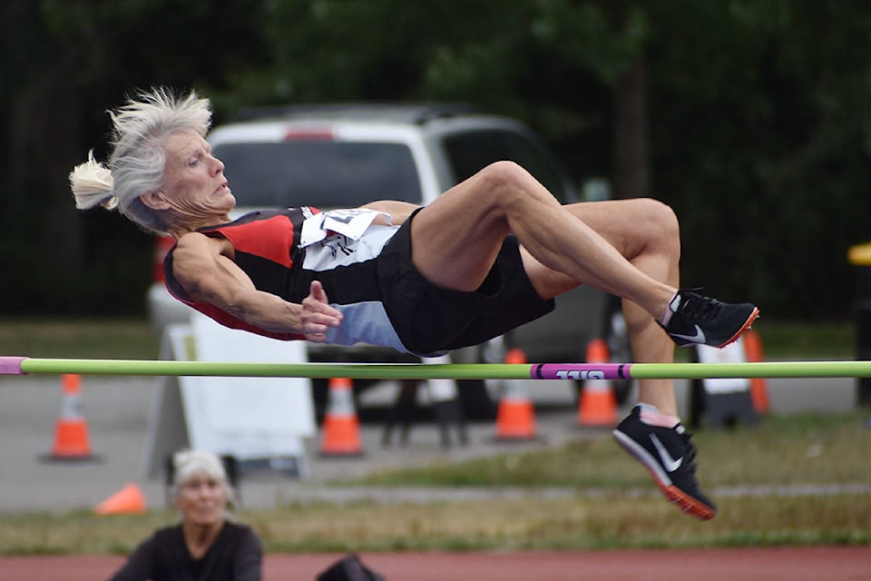 Cloverdales Cindy O’Brien Hugh clears the bar during womens high jump at the BC Masters Track Field Championships at Bear Creek Park Sunday afternoon. (Aaron Hinks photo)