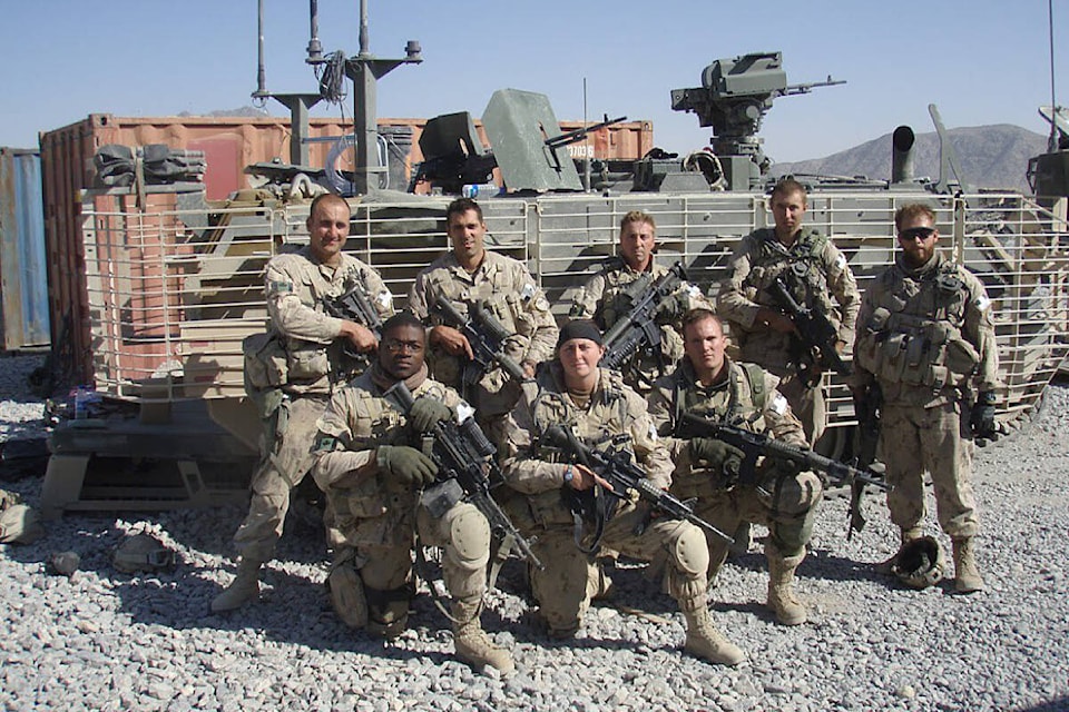 Master Corporal (ret’d) Mitchel Claypool (kneeling on right) is seen with his section, E33D, in Sperwan Ghar, Kandahar, Afghanistan in September 2007. (Photo submitted: Mitchel Claypool)