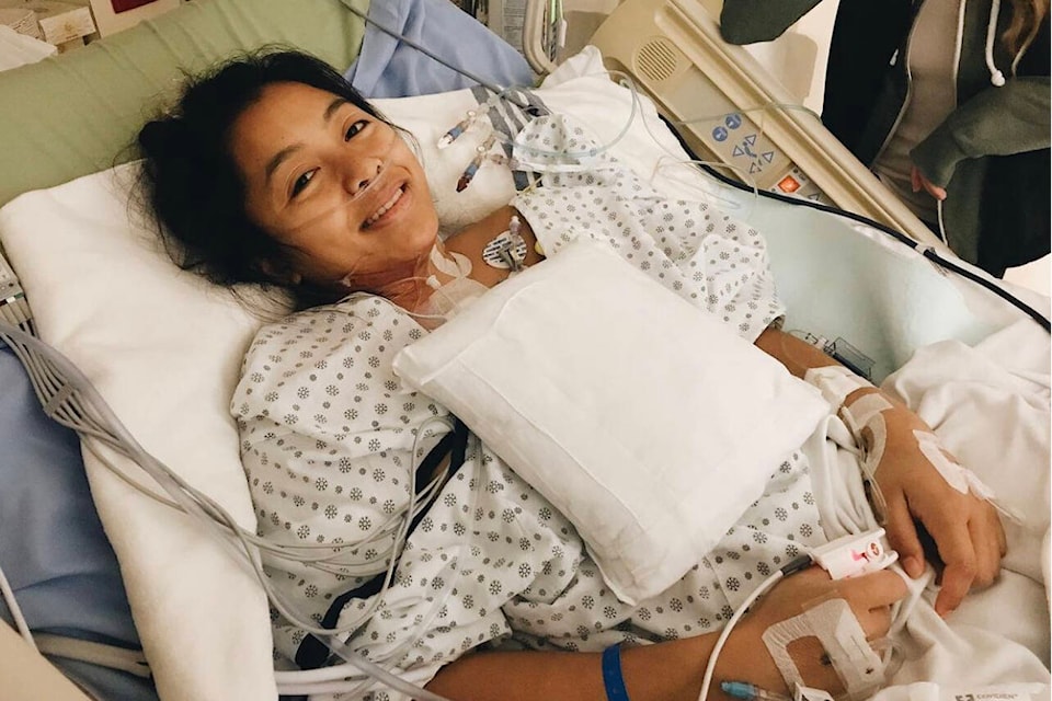 Kim Touen, who underwent surgery in 2018 for a rare cancer, smiles for a photo in hospital. (Contributed photo)