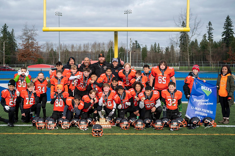 The Cloverdale Community Football Association’s Peewee Bobcats celebrate after winning a provincial title Dec. 5 as they beat the Abbotsford Falcons 44-0 in the championship game. (Photo submitted: Yeera Sami)