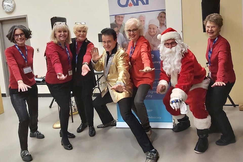 CARP White Rock Surrey members ham it up with Steve ‘Elvis’ Elliott at the White Rock Community Centre on Dec. 4, 2021. (Contributed photo)