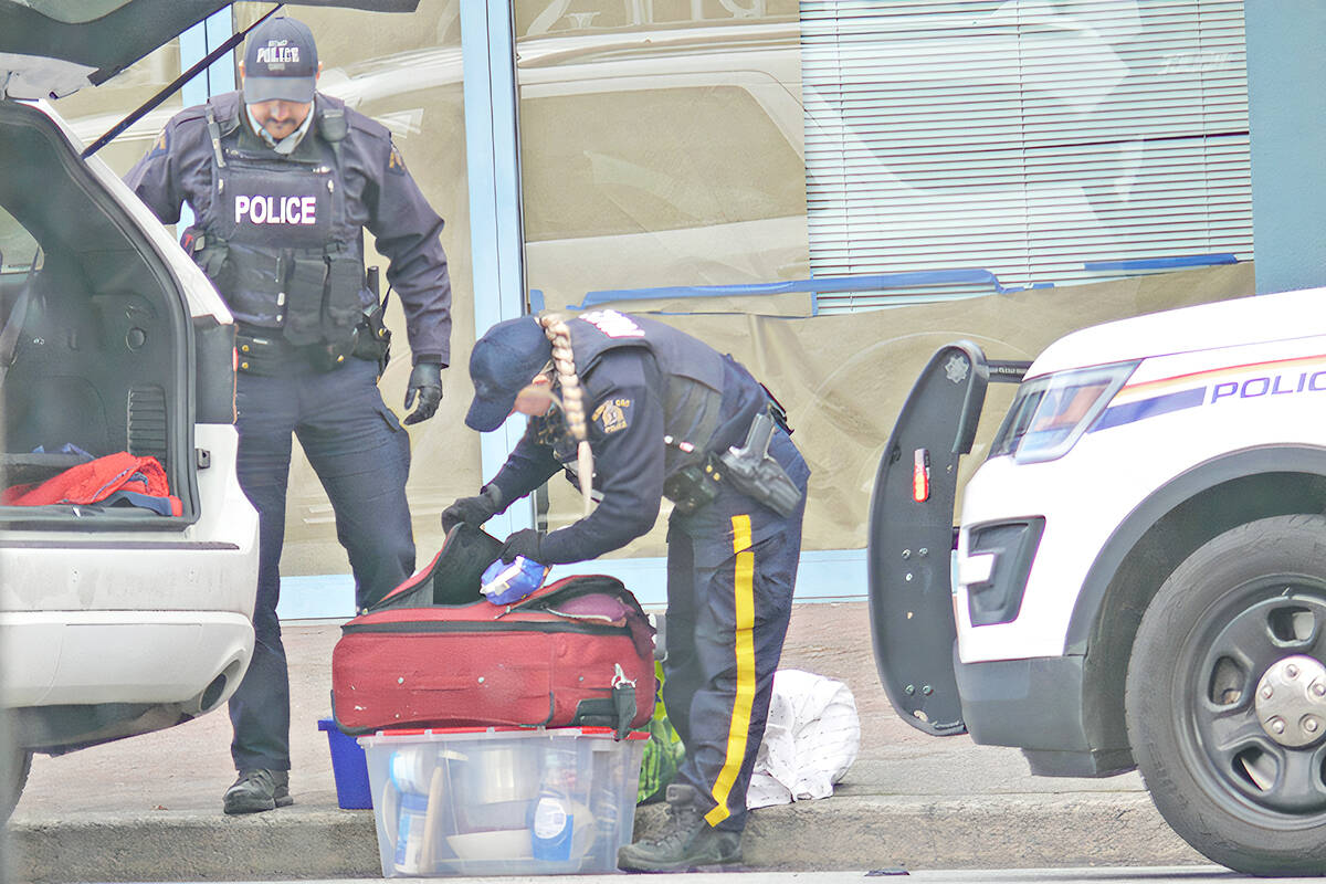 Langley RCMP officers searched an SUV and seized a quality of fake gold in Langley City on Wednesday, March 16, in the 20200 block of Fraser Highway. Because the suspect wasnt caught in the act, he was released without being charged after they agreed to get out of town. (Dan Ferguson/Langley Advance Times)