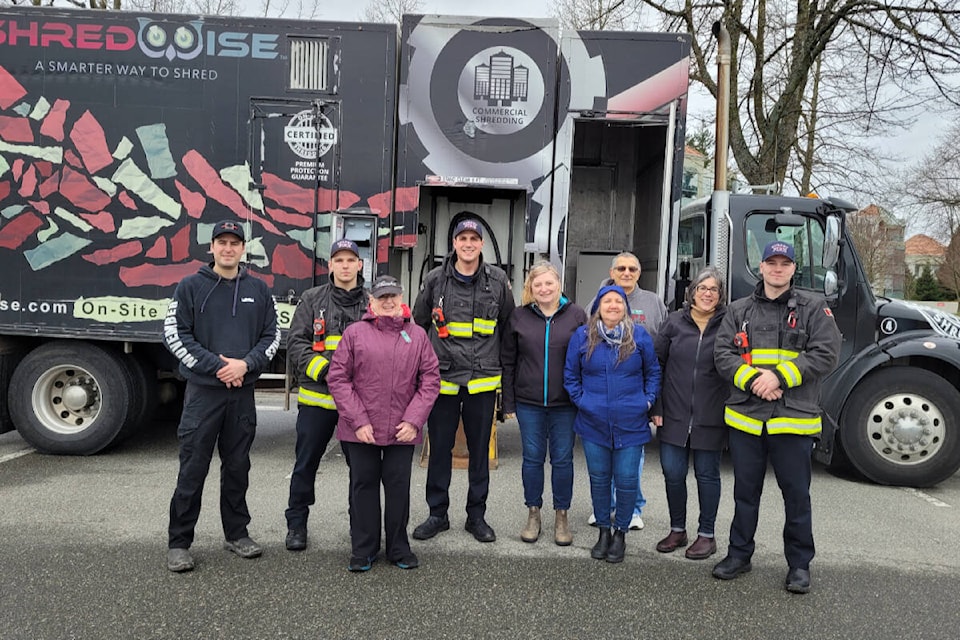 Surrey firefighters helped raise more than $9,000 for the Sources South Surrey/White Rock Food Bank at a shredding event hosted by Semiahmoo Shopping Centre on March 26, 2022. (Contributed photo)