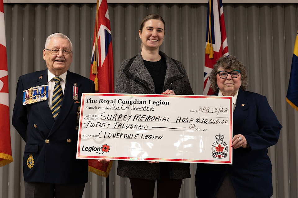 Kimberly Coates (centre) accepts a cheque for $20K from poppy fund committee co-chairs Earle Fraser (left) and Pat Keeping. Surrey Memorial Hospital will use the money—raised by the Cloverdale Legion in the 2021 poppy campaign—to buy medical equipment. (Photo: Jason Sveinson)