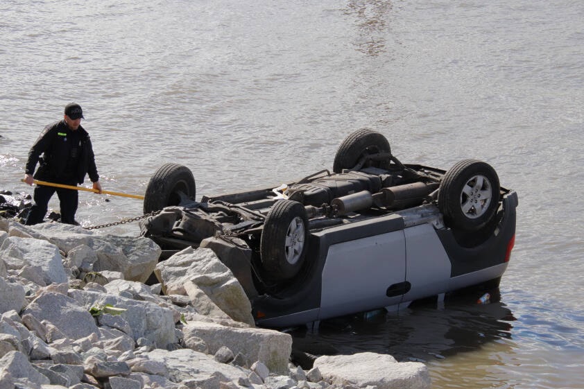 One person was taking to hospital following a crash that left an SUV on its roof in the Fraser River. (Shane MacKichan photo)