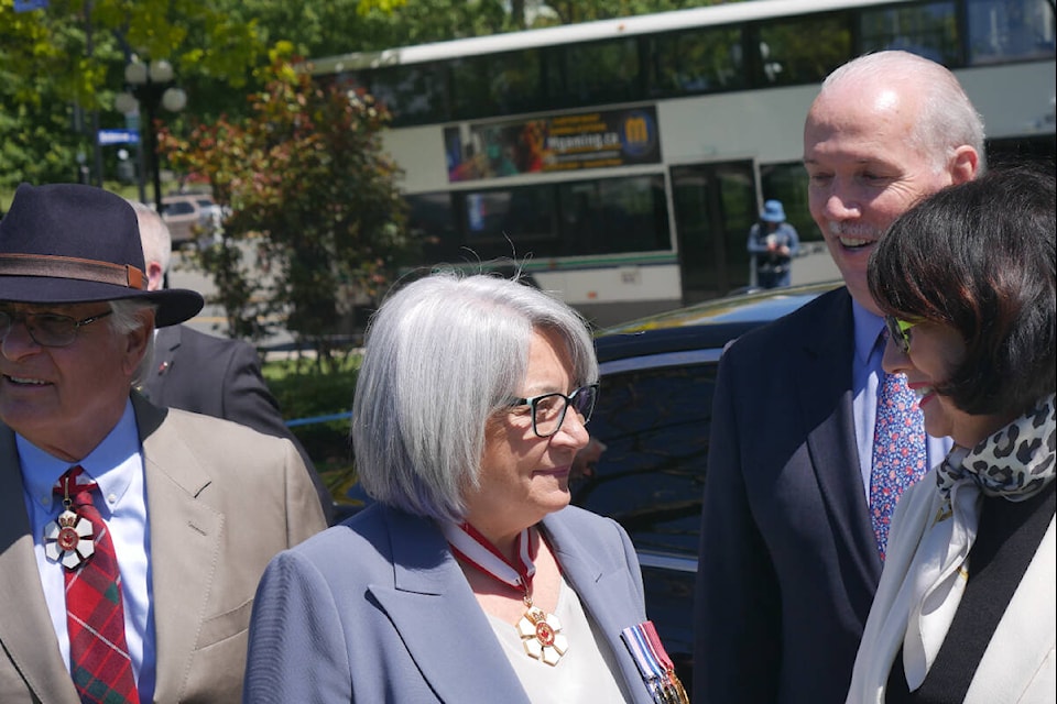 Gov.-Gen. Mary Simon and husband Whit Fraser are met by Premier John Horgan and Lt.-Gov. Janet Austin at their vehicle procession on the legislature grounds Friday, May 20. (Evert Lindquist/News Staff)