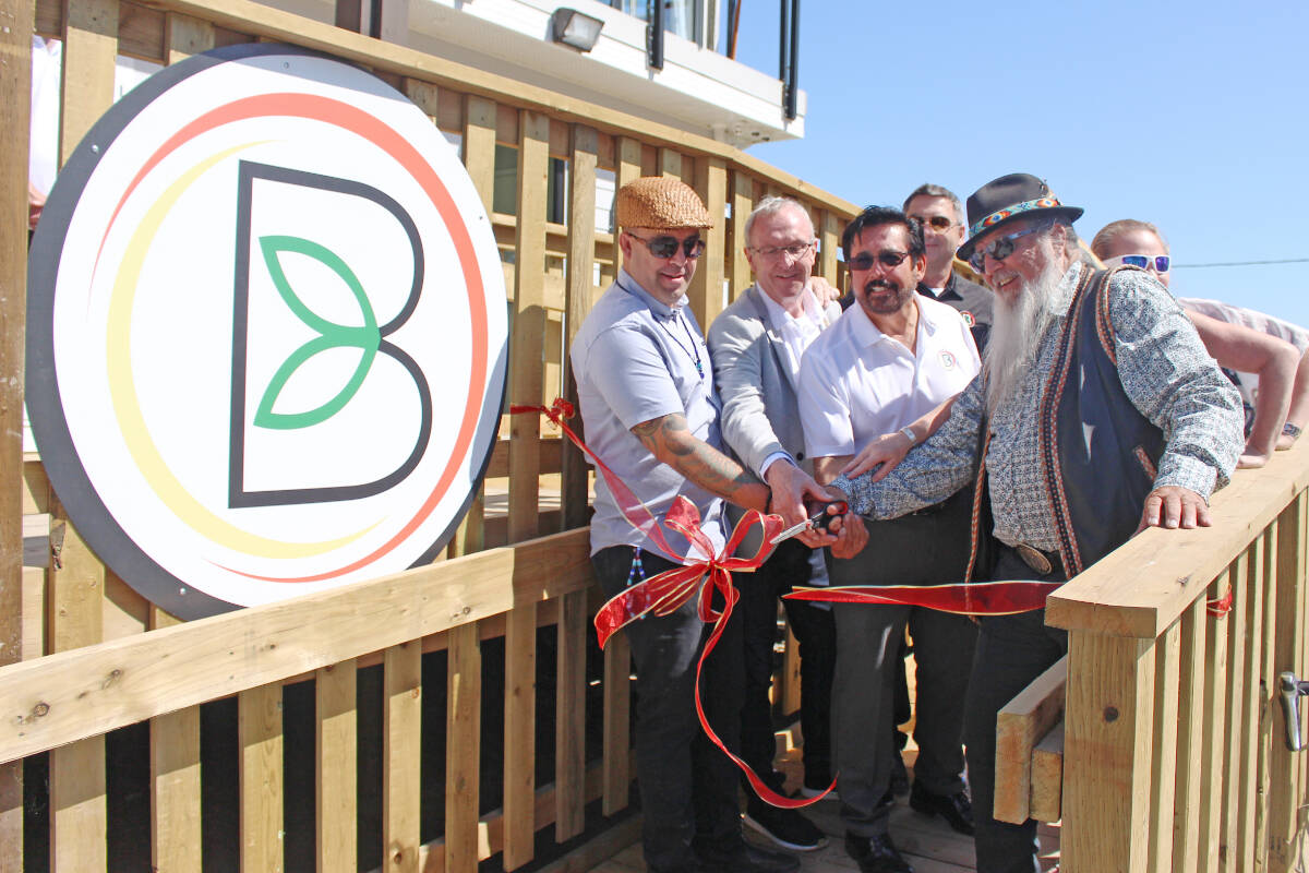 Surrey First mayoral candidate Gordie Hogg, second from left, during a 2019 ribbon cutting and grand opening of Indigenous Bloom, a cannabis dispensary on Semiahmoo First Nation land. While Hogg did not respond to a request for comment on his stance on cannabis stores in Surrey, he was a Liberal MP during legalization on Oct. 17, 2018. (File photo: Lauren Collins)