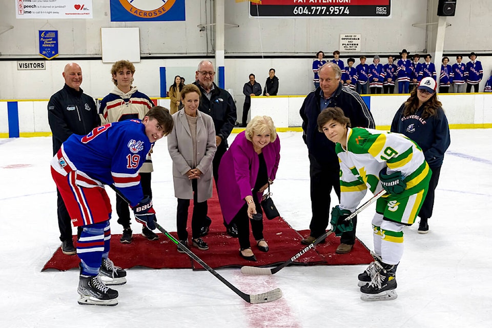 Mayor-elect Brenda Locke drops the puck between Keegan Bankier (Cloverdale U18 A1 Assistant Captain, left) and Kai Sloan (South Delta Storm U18 A1 Captain) for a ceremonial faceoff at a Cloverdale Colts game Oct. 20. The ceremony was held to celebrate 50 years of the Cloverdale Minor Hockey Association. Others in the picture from left: Craig Sherbaty (CMHA director of hockey), Cam Miller (former player and emcee), Linda Annis (councillor), Rob Stutt (councillor-elect and CMHA lifetime member), Mike Bose (councillor-elect and CMHA lifetime member), and Deanna Cox (CMHA president). (Photo: Jason Sveinson)