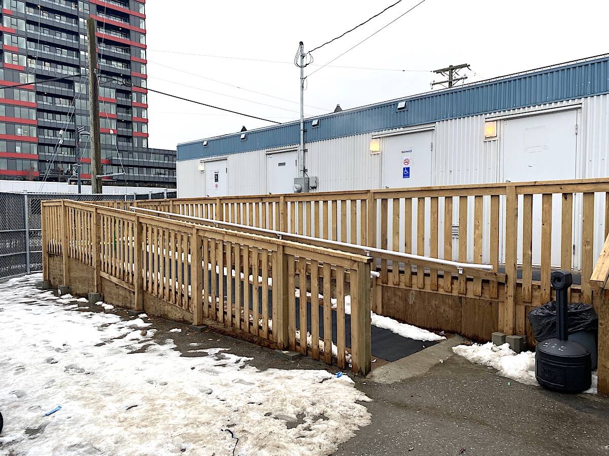 Inside the gates of Whalleys new hygiene facility, or Healthy Living Complex of Care, with the new Veterans Village building in the distance, on Wednesday, Dec. 7, 2022. (Photo: Tom Zillich)