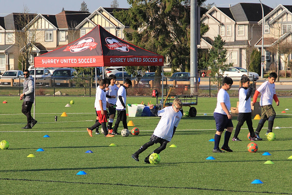 Kids practice at Cloverdale Athletic Park March 22. Jeff Clarke, the sporting director for Surrey United Soccer Club, says there is a lack of available turf fields to play soccer on around the city and that the problem is reaching a crisis point. (Photo: Malin Jordan)