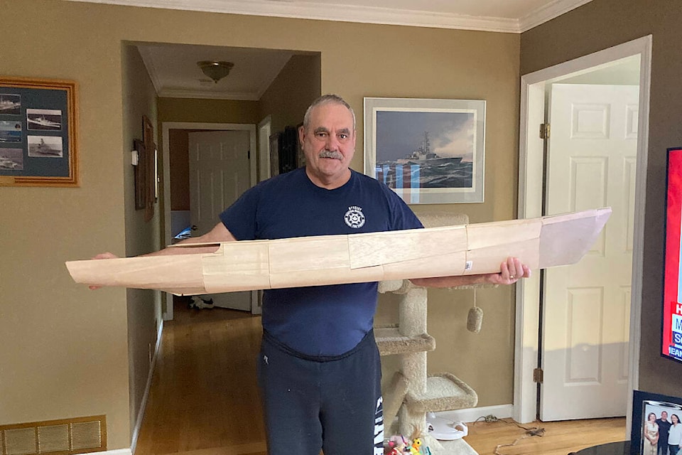 Yvon Lehoux holds the hull for a model of the frigate Algonquin (DDG 283). Lehoux is building a detailed model of the ship, one on which he served, after getting blueprints from the Canadian Naval Museum. (Photo submitted: Yvon Lehoux)