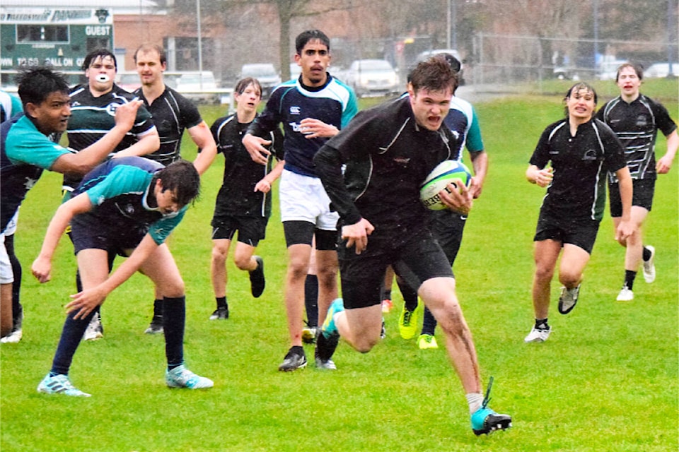 Quinton Bryant runs with the ball for Lord Tweedsmuir in their game against Fleetwood Park April 20. The two teams battled for the Quigley Cup, a rivalry trophy, for the first time since 2019. (Photo submitted: Karly Rheum)
