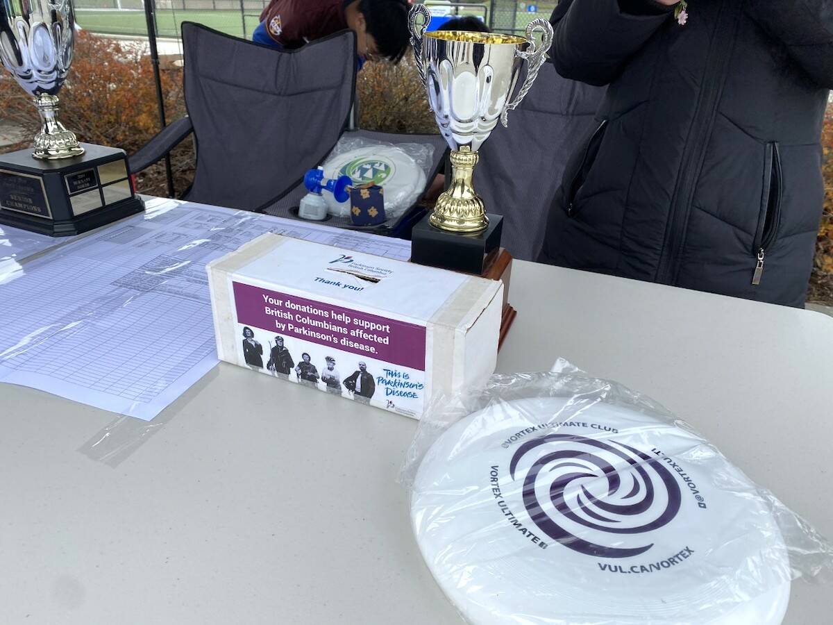 Trophy, disc and donation collection box on a table at the Pull for Parkinsons ultimate tournament held at Newton Athletic Park on Thursday, April 20, 2023. (Photo: Tom Zillich)