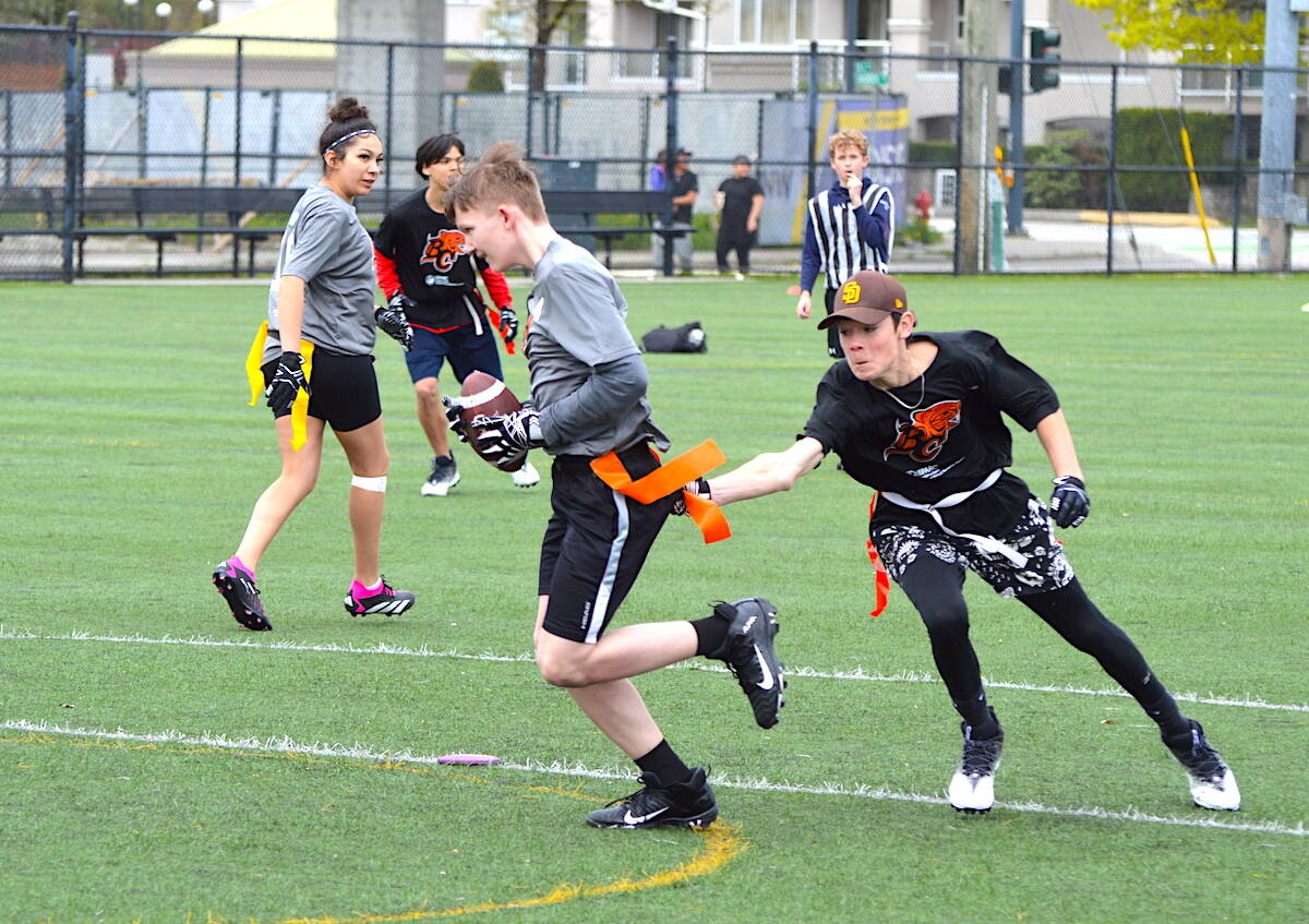 Surrey Dawgs (in grey) and Chilliwack Hornets in action during the BC Lions Indigenous Youth flag football tournament at Tom Binnie Park in Surrey on Sunday, April 30, 2023. (Photo: Tom Zillich)