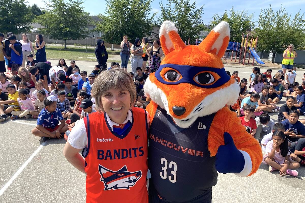 Creekside Elementary principal Margaret Geddes with Vancouver Bandits team mascot Berry the Bandit during a visit to the Surrey school on Thursday, June 8, 2023. (Photo: Tom Zillich)