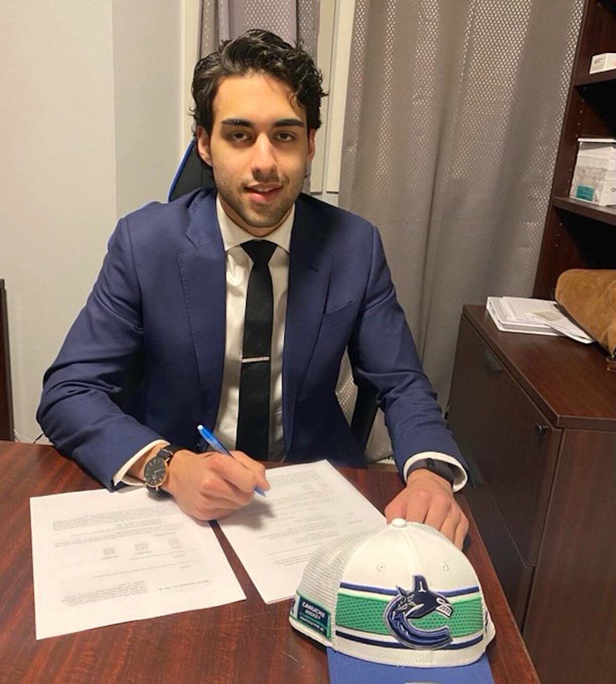 Arshdeep Bains in March 2022 when he signed an entry-level contract with Vancouver Canucks. (Photo: Twitter.com/arshdeepbains_)