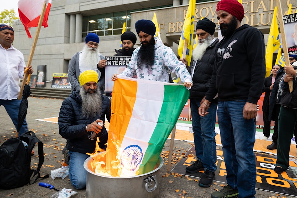 Demonstrators burned several Indian flags outside Surrey provincial court in Surrey on Tuesday, Oct. 1.  