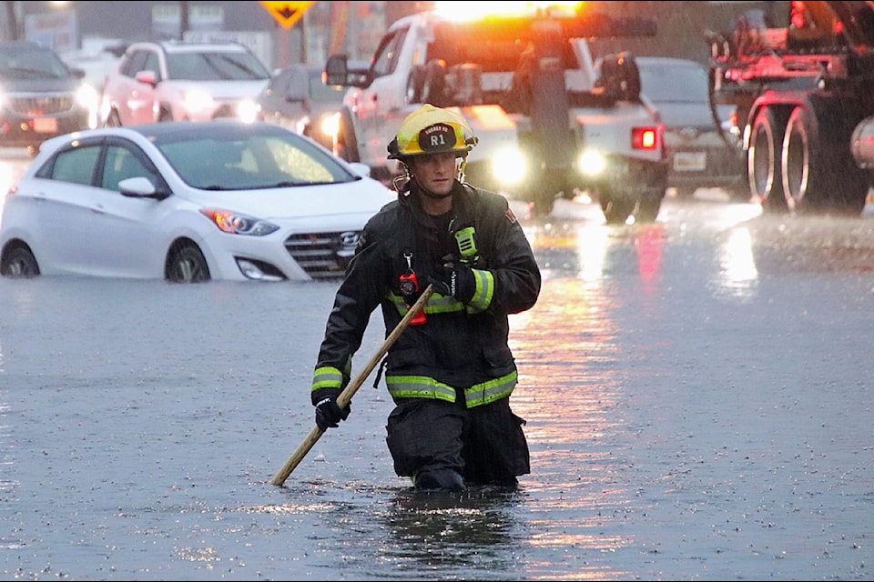 Emergency crews are out in force dealing with road flooding in Surrey during the atmospheric river on Saturday, Oct. 19, 2024, including the area of King George and 128 Street near the foot of the Pattullo Bridge.