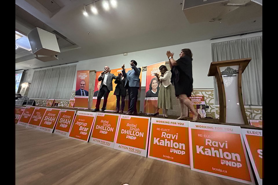 NDP candidates acknowledge supporters at the party's election-night gathering in Surrey at the Dhaliwal Banquet Hall.