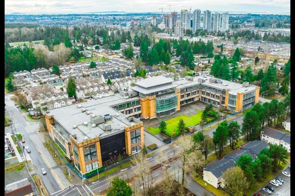 Aerial view of the vacant commercial building at 104 Avenue and 142 Street in Surrey. 