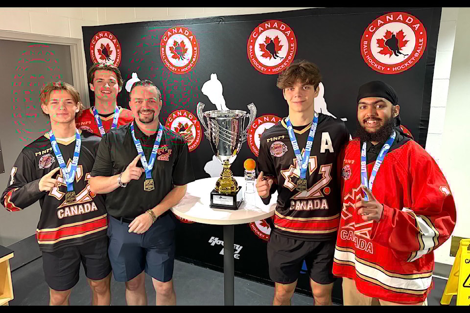 A few local members of Canada's U18 boys ball hockey team with trophy won at the 2024 International Street and Ball Hockey Federation world championship tournament in Zilina, Slovakia on July 7, 2024. Pictured from left to right are James Zazula Campbell, Kainoah Brankovic, coach Jon Silcox, Brandon Osborne and Aalamdaya Kailay.