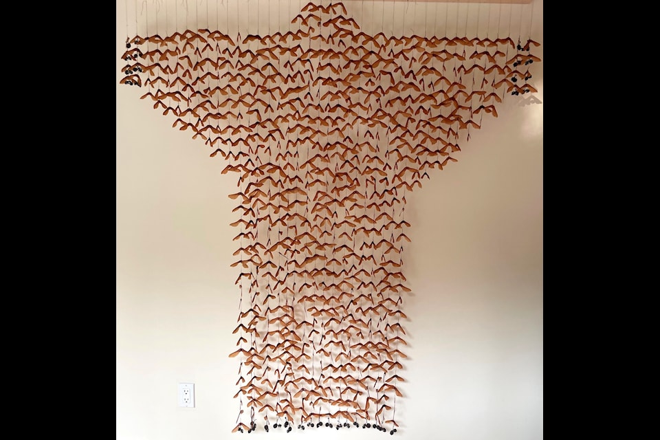 Cora Li-Leger's "Seed Coat (maple)" is made of maple seeds and thread.