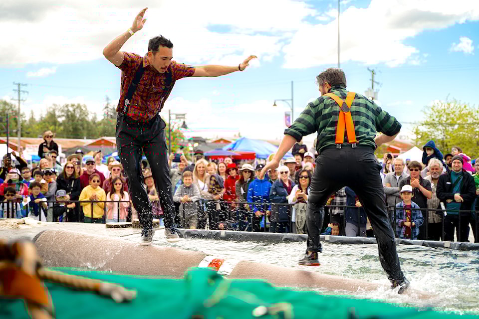 Log roll fight during the Lumberjack Show at Cloverdale Rodeo & Country Fair.
