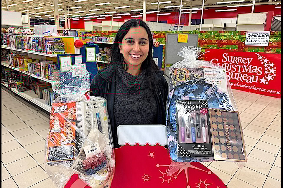 Karmin Dhindsa, program co-ordinator for Surrey Christmas Bureau, with gifts for donation to local families at the organization's Toy Depot in Whalley on Thursday, Nov. 28, 2024.