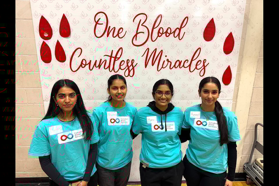 Grade 12 student-volunteers Simone, Arnpreet, Manvi and Avneet (from left) at the blood and stem cell drive at Queen Elizabeth Secondary in Surrey on Tuesday, Jan. 21, 2025.