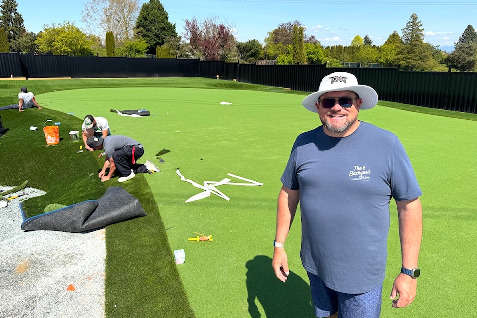 Matt Palsenbarg at The Backyard Golf Club facility being built at the Clayton Hills course in Surrey, with Precision Greens crew at work behind him on April 23, 2025.