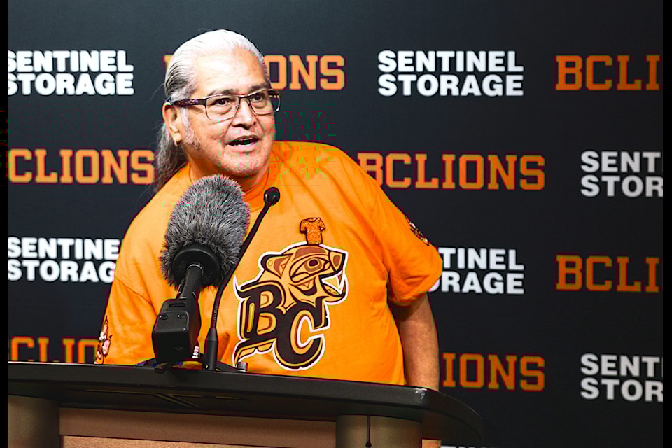 Sempúlyan Gonzales, Elder and member of Squamish Nation Council, wears an Orange Shirt Day Game T-shirt at a BC Lions news conference in Surrey on Thursday, Sept. 19, 2024. 